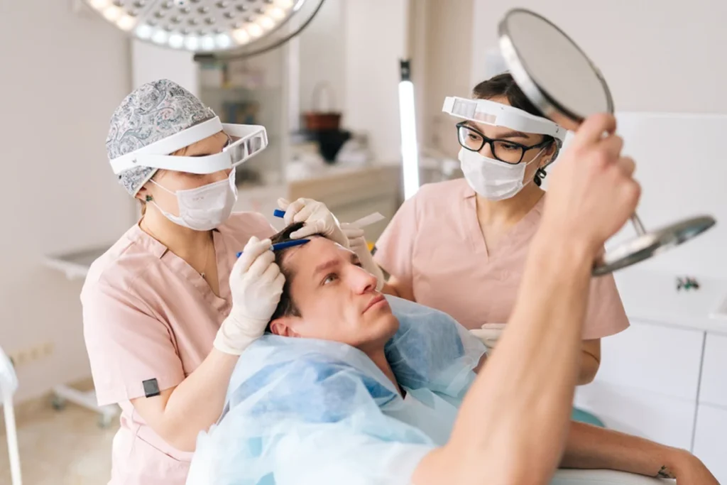 Confident man showing results after Hair Transplant Birmingham procedure.